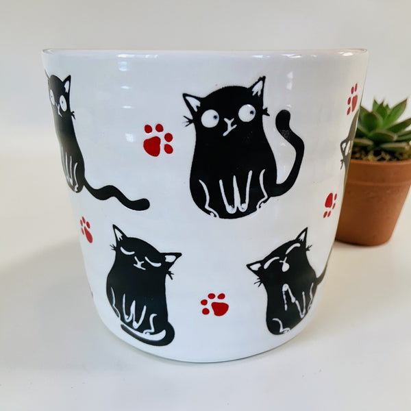 Playful Black Cat & Red Pawprints Coffee Mug